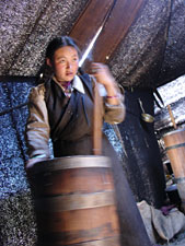 woman churning tea